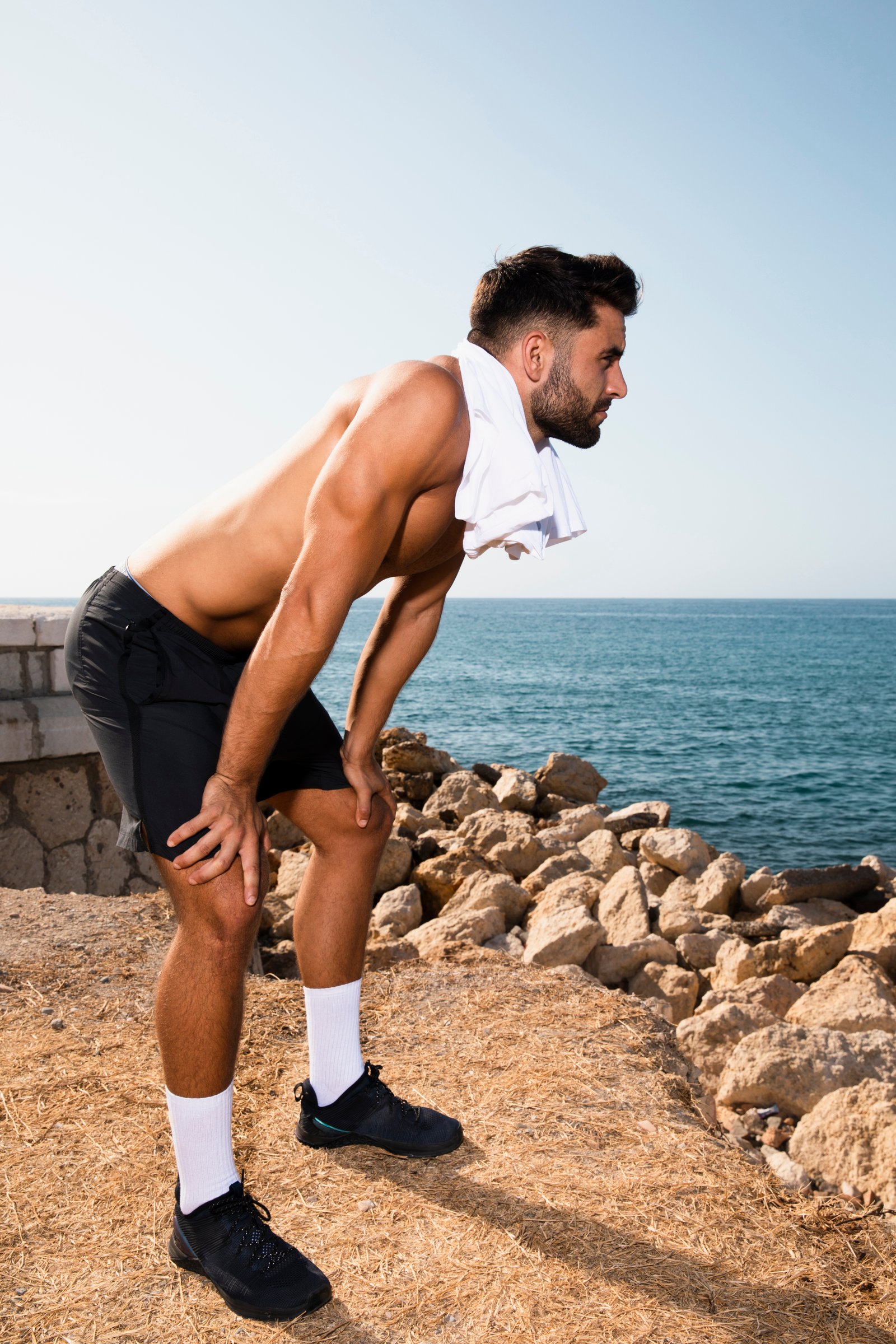 Person holding painful knee joint after workout