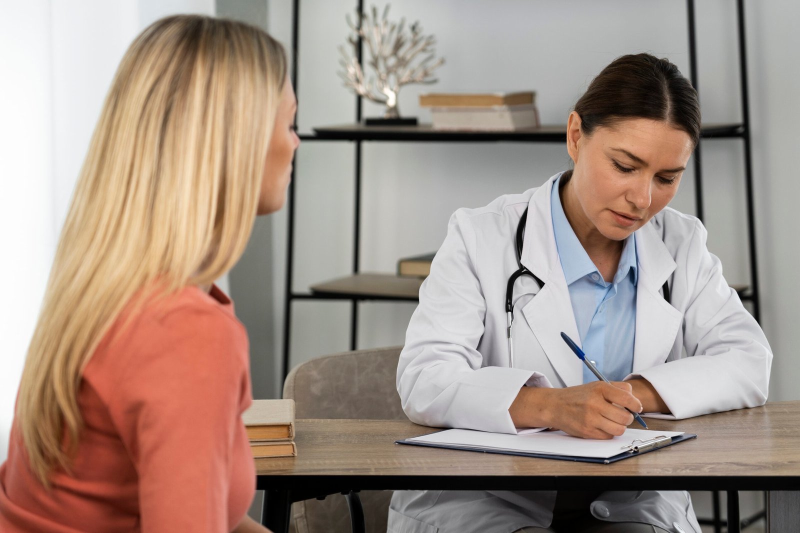 Botox and Antibiotics Consultation Photo Woman reviewing her medications with a provider before Botox