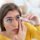 Woman using lubricating eye drops for dry eyes