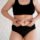 Woman gently pinching a small area of lower belly fat