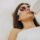 Client in protective eyewear having laser hair removal for upper lip hair
