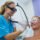 Smiling woman receiving laser hair removal on her face for PCOS and hormonal facial hair at PURE Medical Spa Chicago
