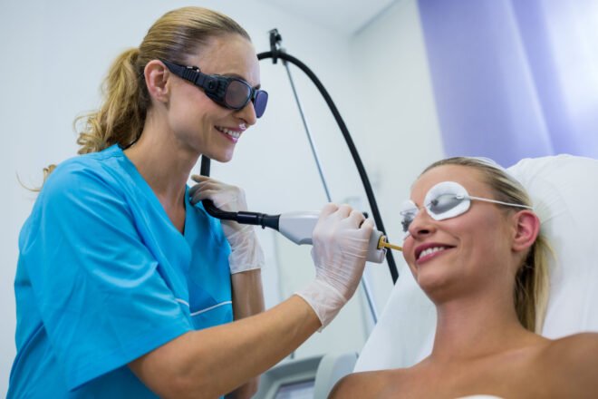 Laser Hair Removal for PCOS Facial Hair in Chicago Smiling woman receiving laser hair removal on her face for PCOS and hormonal facial hair at PURE Medical Spa Chicago