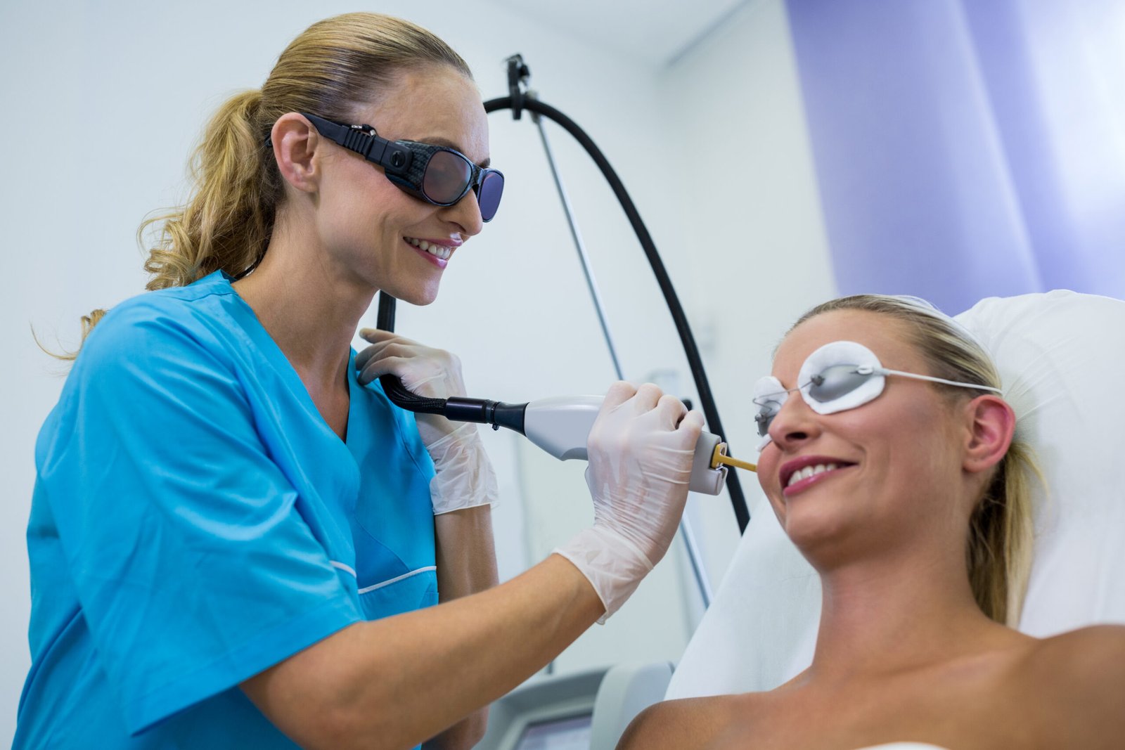 Smiling woman receiving laser hair removal on her face for PCOS and hormonal facial hair at PURE Medical Spa Chicago