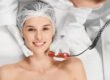 Smiling woman relaxing during a professional microdermabrasion facial at a Chicago med spa