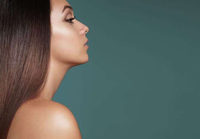 Side profile of a woman with a smooth, defined jawline