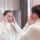 Woman in a med spa checking her cheeks and facial volume in a mirror