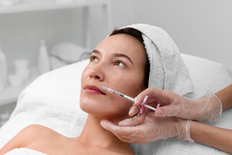 Sculptra for Hollowing Around the Mouth in Chicago Provider gently injecting the lower cheek beside the mouth to plan Sculptra for hollowing around the mouth