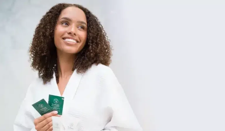 VI Peel vs IPL for Pigmentation Smiling woman holding a VI Peel treatment kit, comparing VI Peel and IPL for pigmentation and sun spots in Chicago